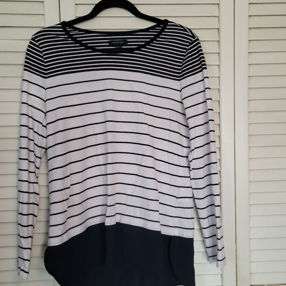 Nautica knit shirt, navy/white stripe with navy blouse peaking out from bottom.